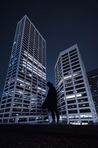 Preview wallpaper silhouette, dark, buildings, skyscrapers, roof