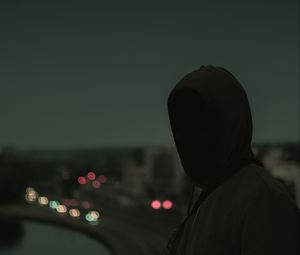 Preview wallpaper silhouette, dark, hood, twilight, gloomy