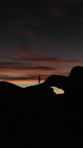 Preview wallpaper silhouette, dark, rocks, twilight, evening