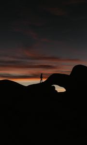 Preview wallpaper silhouette, dark, rocks, twilight, evening