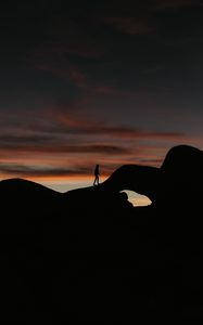 Preview wallpaper silhouette, dark, rocks, twilight, evening