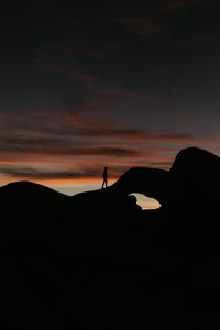 Preview wallpaper silhouette, dark, rocks, twilight, evening