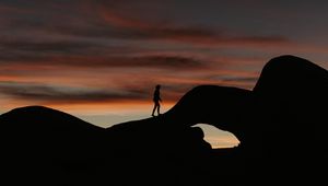 Preview wallpaper silhouette, dark, rocks, twilight, evening