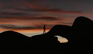 Preview wallpaper silhouette, dark, rocks, twilight, evening