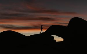 Preview wallpaper silhouette, dark, rocks, twilight, evening