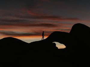 Preview wallpaper silhouette, dark, rocks, twilight, evening