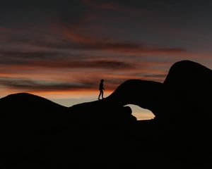 Preview wallpaper silhouette, dark, rocks, twilight, evening