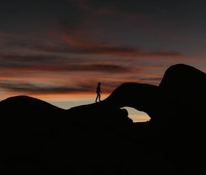 Preview wallpaper silhouette, dark, rocks, twilight, evening