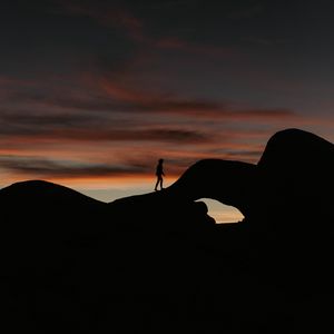 Preview wallpaper silhouette, dark, rocks, twilight, evening