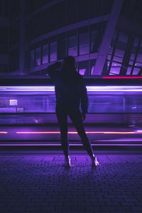 Preview wallpaper silhouette, figure, neon, light, purple, dark