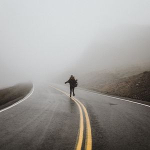 Preview wallpaper silhouette, fog, road, run, lonely, loneliness