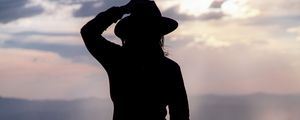 Preview wallpaper silhouette, hat, mountains, dark