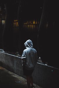 Preview wallpaper silhouette, hood, dark, pavement, architecture, columns