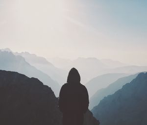 Preview wallpaper silhouette, hood, loneliness, mountains, fog
