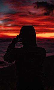 Preview wallpaper silhouette, hood, sunset, darkness