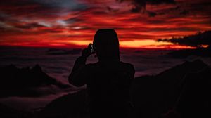 Preview wallpaper silhouette, hood, sunset, darkness