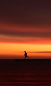 Preview wallpaper silhouette, horizon, running, twilight, sunset, red