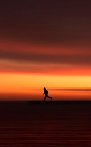 Preview wallpaper silhouette, horizon, running, twilight, sunset, red
