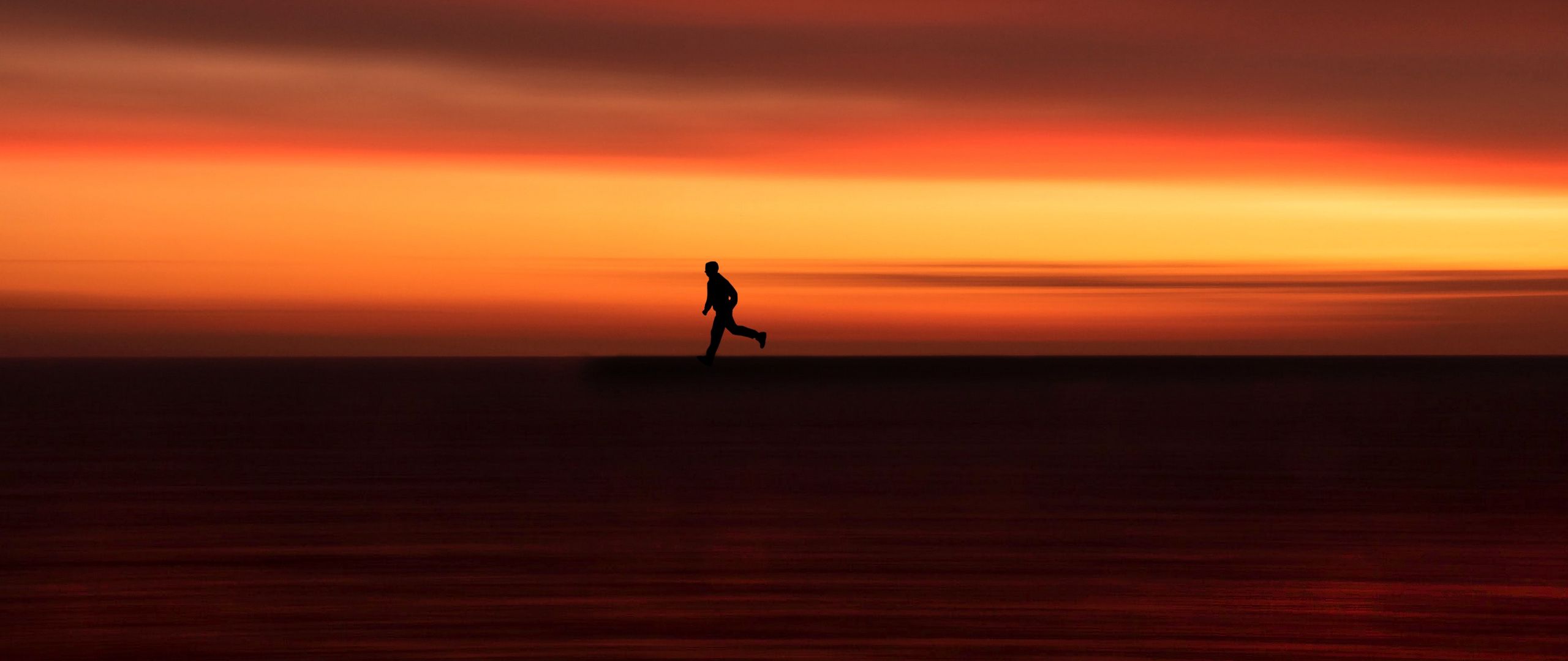 Download wallpaper 2560x1080 silhouette, horizon, running, twilight