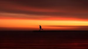 Preview wallpaper silhouette, horizon, running, twilight, sunset, red