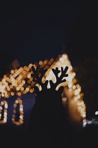 Preview wallpaper silhouette, horns, dark, house, lights, bokeh