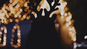 Preview wallpaper silhouette, horns, dark, house, lights, bokeh