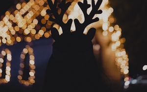 Preview wallpaper silhouette, horns, dark, house, lights, bokeh