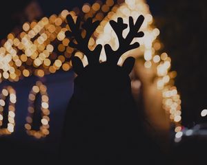 Preview wallpaper silhouette, horns, dark, house, lights, bokeh