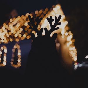 Preview wallpaper silhouette, horns, dark, house, lights, bokeh