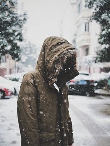 Preview wallpaper silhouette, jacket, hood, snow, winter