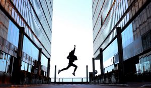 Preview wallpaper silhouette, jump, night, buildings