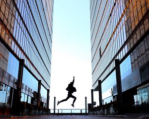 Preview wallpaper silhouette, jump, night, buildings