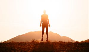 Preview wallpaper silhouette, jump, sunlight, bright, sunset