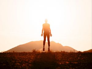 Preview wallpaper silhouette, jump, sunlight, bright, sunset