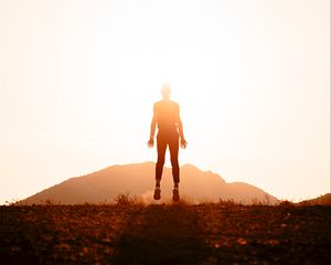 Preview wallpaper silhouette, jump, sunlight, bright, sunset