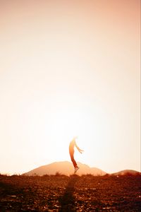 Preview wallpaper silhouette, jump, sunlight, sunset, bright