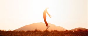 Preview wallpaper silhouette, jump, sunlight, sunset, bright