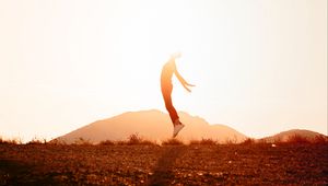 Preview wallpaper silhouette, jump, sunlight, sunset, bright