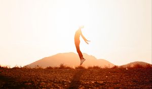 Preview wallpaper silhouette, jump, sunlight, sunset, bright