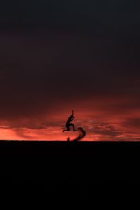 Preview wallpaper silhouette, jump, sunset, night