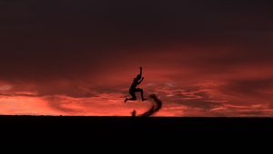 Preview wallpaper silhouette, jump, sunset, night