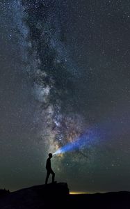 Preview wallpaper silhouette, loneliness, alone, flashlight, starry sky
