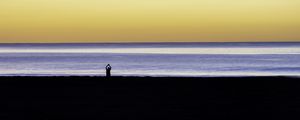 Preview wallpaper silhouette, loneliness, alone, beach, sunset, sea