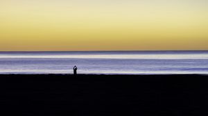 Preview wallpaper silhouette, loneliness, alone, beach, sunset, sea