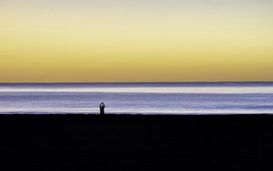 Preview wallpaper silhouette, loneliness, alone, beach, sunset, sea