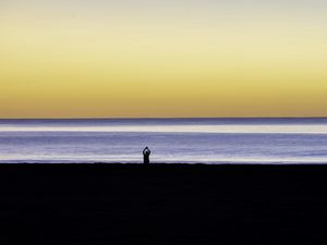 Preview wallpaper silhouette, loneliness, alone, beach, sunset, sea