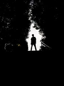 Preview wallpaper silhouette, man, dark, trees