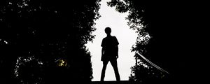 Preview wallpaper silhouette, man, dark, trees