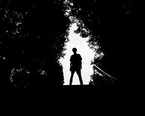 Preview wallpaper silhouette, man, dark, trees