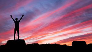 Preview wallpaper silhouette, man, hill, sunset